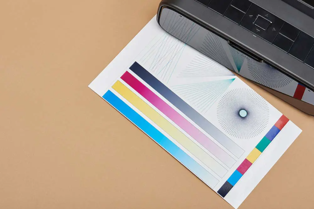 123.hp.setup performing a test print displaying color calibration and alignment patterns on a beige background.